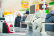 Photo: Empty cash desk with terminal in supermarket Empty cash desk with terminal in supermarket