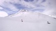 Tourists go on skis on mountain Tiefenbach downwards