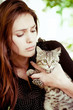 Surprised girl with a little cat