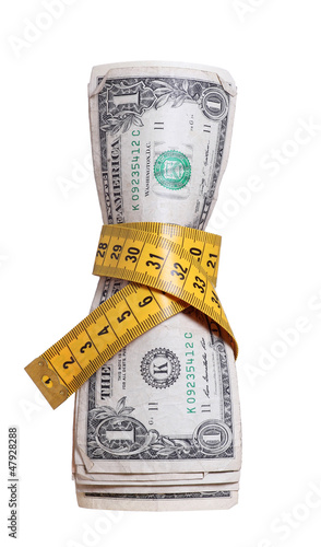 Photo: dollars with measure tape dollars with measure tape