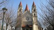People walk in front of Franz von Assizi Church in Vienna