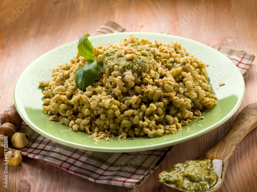 Photo: spelt with pesto sauce and hazel nut, vegetarian food spelt with pesto sauce and hazel nut, vegetarian food