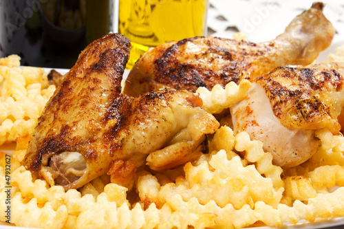 Photo: baked chicken with french fries baked chicken with french fries