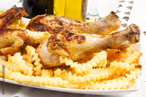 Photo: baked chicken with french fries baked chicken with french fries