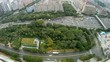 Cars go on highway near to skyscrapers, panorama