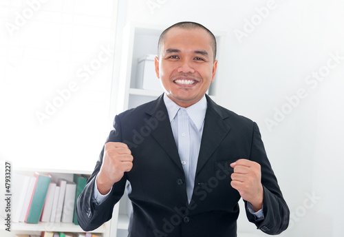 Photo: Excited Southeast Asian businessman Excited Southeast Asian businessman