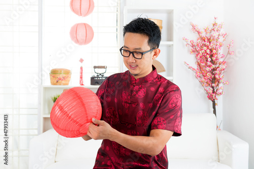 Photo: Chinese man decorating house Chinese man decorating house