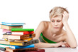 Photo: Young student woman with lots of books studying for exams Young student woman with lots of books studying for exams