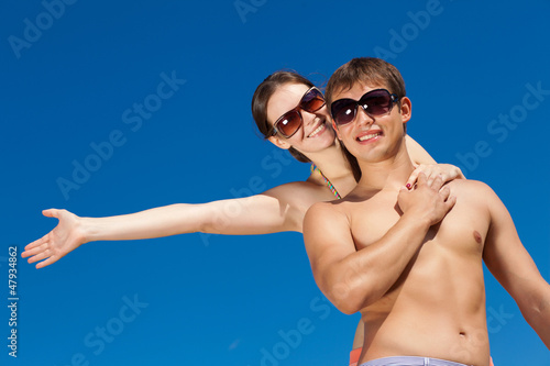 Photo: Happy Young Couple Together On The Beach Happy Young Couple Together On The Beach