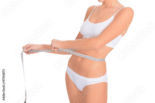 Photo: woman with measure tape, white background woman with measure tape, white background