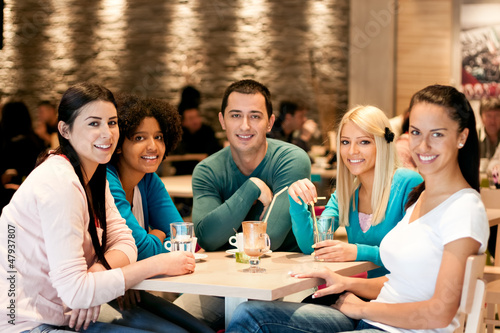 Photo: Group of teenagers in cafe Group of teenagers in cafe