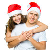 Beautiful Christmas couple in Santa hats
