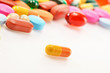 Composition with dietary supplement capsules and drug pills