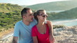 Video: Happy couple looking at beautiful landscape, crane shot Happy couple looking at beautiful landscape, crane shot