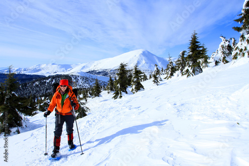 Photo: Winter hiking in snowshoes. Winter hiking in snowshoes.