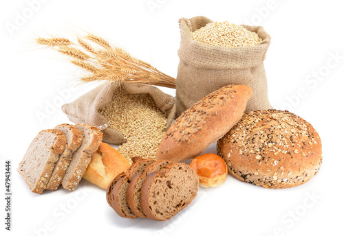 Photo: Assortment of baked bread over sack of wheat Assortment of baked bread over sack of wheat