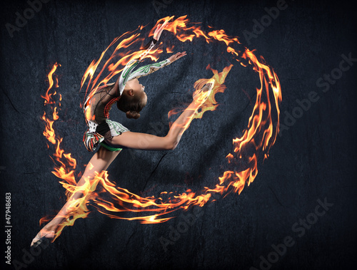 Photo: Young woman in gymnast suit posing Young woman in gymnast suit posing