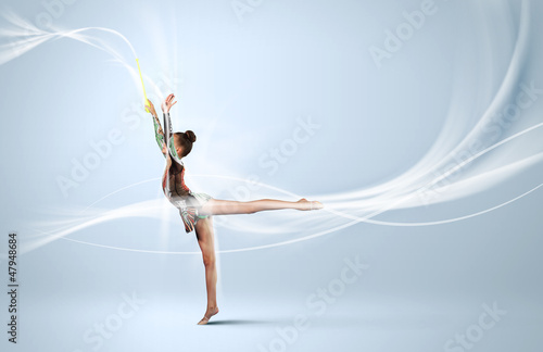 Photo: Young woman in gymnast suit posing Young woman in gymnast suit posing