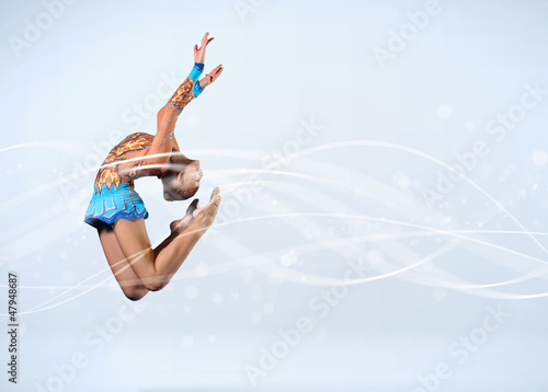 Photo: Young woman in gymnast suit posing Young woman in gymnast suit posing