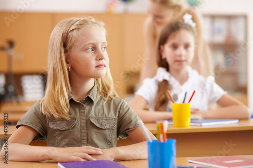Photo: Little girl at school class Little girl at school class