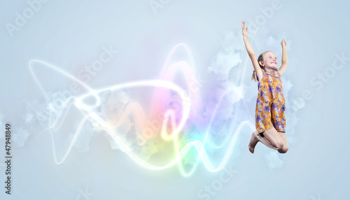 Photo: happy kid jumping happy kid jumping