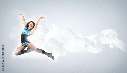 Photo: Young woman dancer. With lights effect. Young woman dancer. With lights effect.