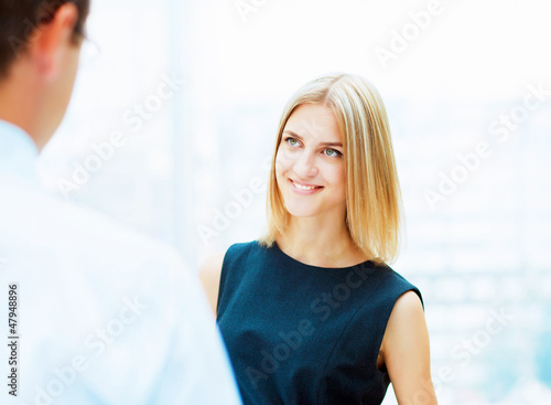 Photo: Two young business collegues. Two young business collegues.