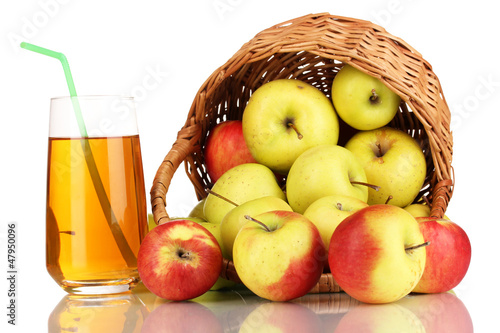 Photo: Useful apple juice with apples around in basket isolated Useful apple juice with apples around in basket isolated