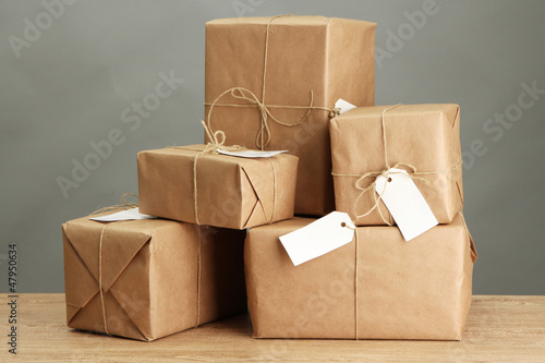 Photo: parcels boxes with kraft paper, parcels boxes with kraft paper,