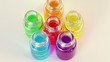 Six transparent open bottles rotates with color oil