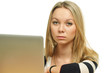 Close-up of a sad young woman in front of the laptop
