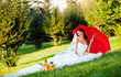 Photo: beautiful bride portrait with red umbrella beautiful bride portrait with red umbrella