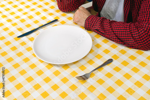 Photo: Man at the dinner table Man at the dinner table