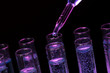 test-tubes with liquid on black background