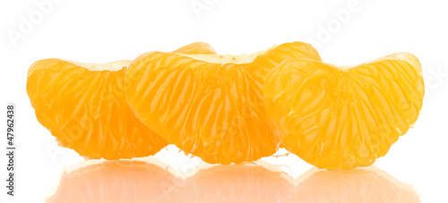 Photo: Ripe sweet tangerine cloves, isolated on white Ripe sweet tangerine cloves, isolated on white
