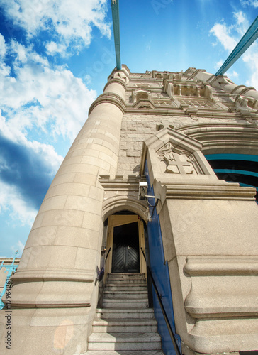 Photo: Powerful structure of Tower Bridge in London with clouds in the Powerful structure of Tower Bridge in London with clouds in the