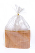 Bread in the plastic bag isolated on white background