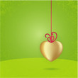 Vector Valentine's card. Golden heart on fresh green background.