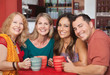 Happy Friends at Cafe Table