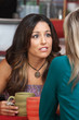 Concerned Hispanic Woman with Friend