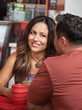Photo: Skeptical Woman Looking at Man in Cafe Skeptical Woman Looking at Man in Cafe