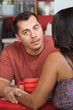 Man Comforts Friend in Cafe