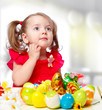 Photo: girl paints eggs girl paints eggs