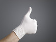 Hand with a latex glove expressing positivity