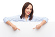 Woman pointing at blank poster