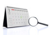 Desk Calendar and magnifier isolated on white