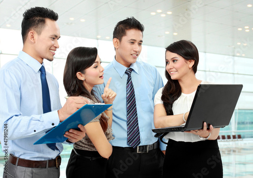 Photo: group of business people meeting with laptop group of business people meeting with laptop