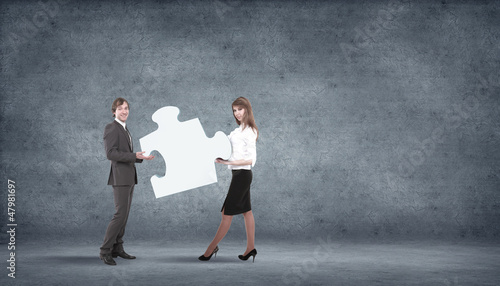 Photo: Piece of puzzle and business persons Piece of puzzle and business persons
