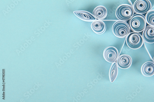 Photo: beautiful paper snowflake, on blue background beautiful paper snowflake, on blue background
