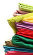 heap of cloth fabrics on wooden table